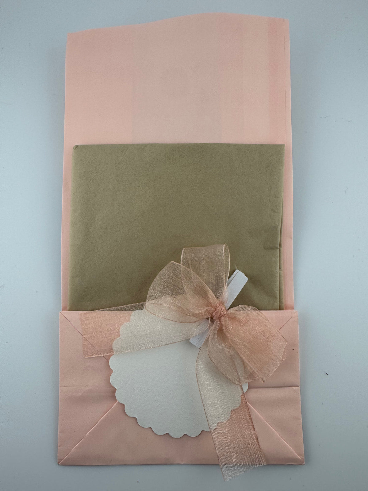 Hand Crafted paper bag apricot colour & flowers with tissue paper and card.